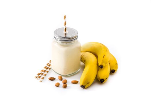 Banana smoothie in jar isolated on white background