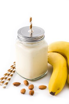 Banana smoothie with almond in jar isolated on white background