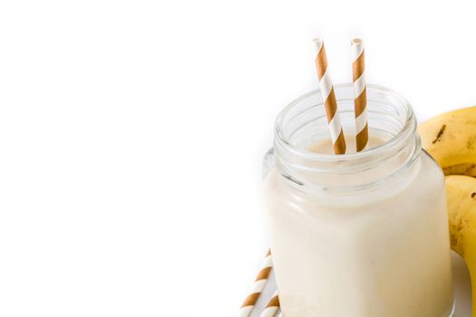 Banana smoothie with almond in jar isolated on white background