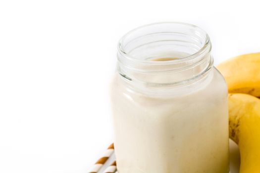 Banana smoothie with almond in jar isolated on white background