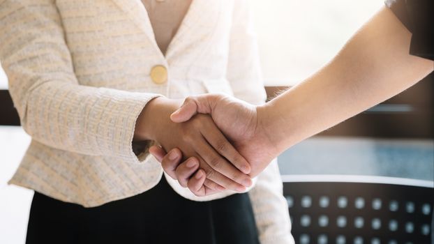 business people handshake for teamwork of business merger and acquisition.