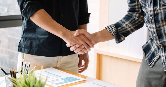 business people handshake for teamwork of business merger and acquisition.