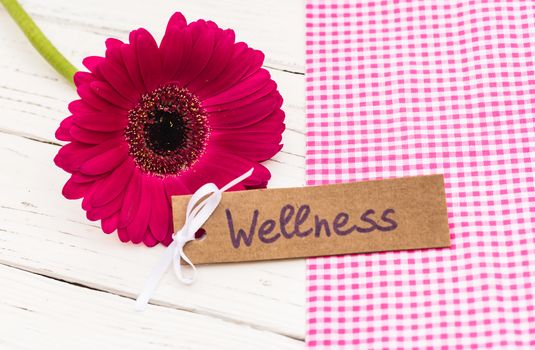 Gift card label for wellness with beautiful pink flower decoration