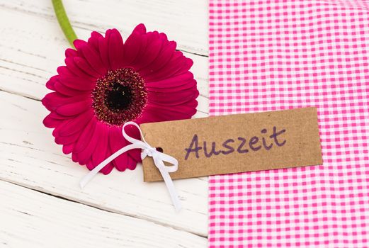 Gift card for timeout, label with german word, Auszeit, means timeout and beautiful pink flower