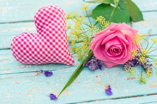 Pink heart and rose flower, romantic love decoration on turquoise wooden background