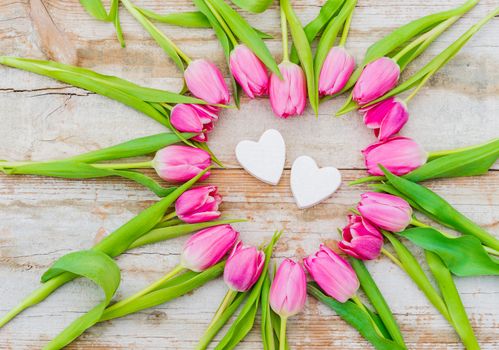 Valentine background with pink flower heart and two heart shapes 