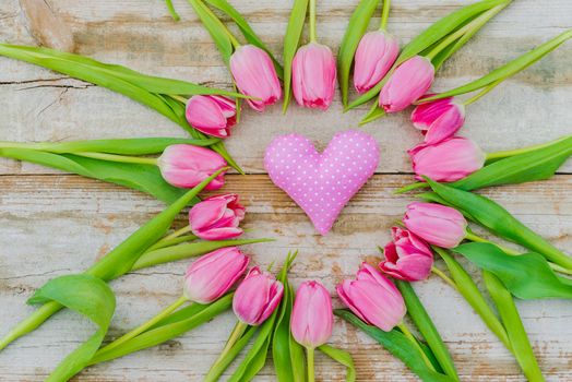 Pink tulip flowers heart shape with little fabric heart decoration