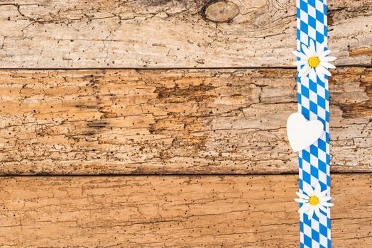 Oktoberfest background with old wooden planks and traditional blue white pattern