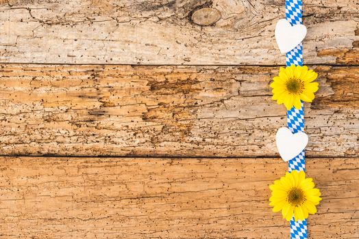 Rustic background for Oktoberfest Munich with bavarian pattern, flowers and hearts