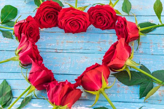 Romantic love background with heart shape of red roses