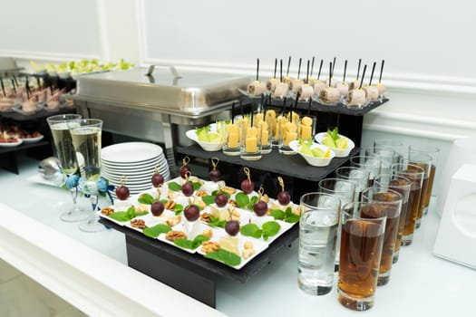 Festive buffet table with many snacks and appetizers.