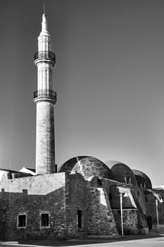 Turkish Minaret and Mosque in the city of Rethymnon on the island of Crete, black and white