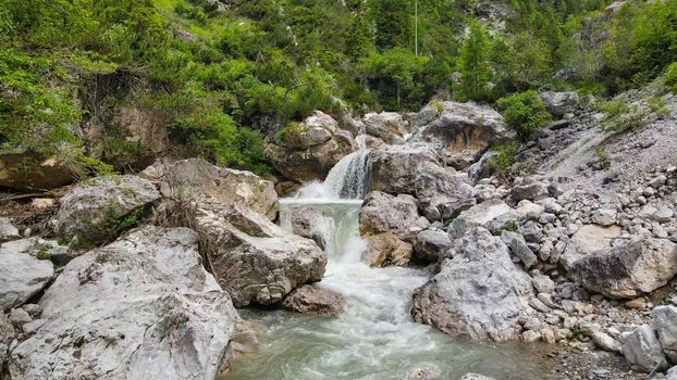 Beautiful mountain waterfalls as seen from a drone, alpin landscape