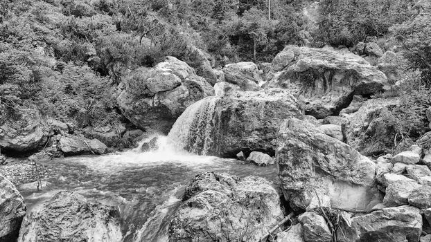 Beautiful mountain waterfalls as seen from a drone, alpin landscape