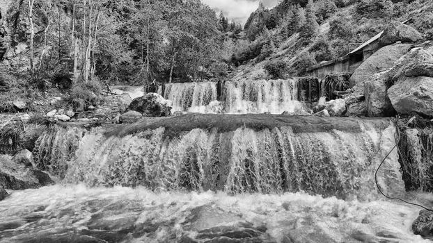 Beautiful mountain waterfalls as seen from a drone, alpin landscape