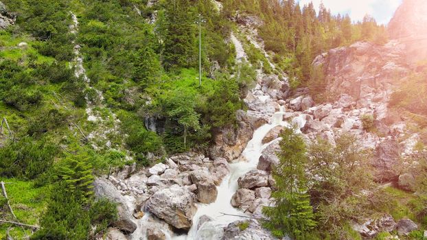 Beautiful mountain waterfalls as seen from a drone, alpin landscape