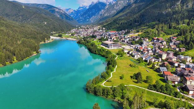 Aerial view of Auronzo Lake and Town in summertime, italian dolomites.