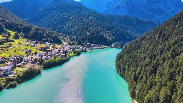 Aerial view of Auronzo Lake and Town in summertime, italian dolomites.