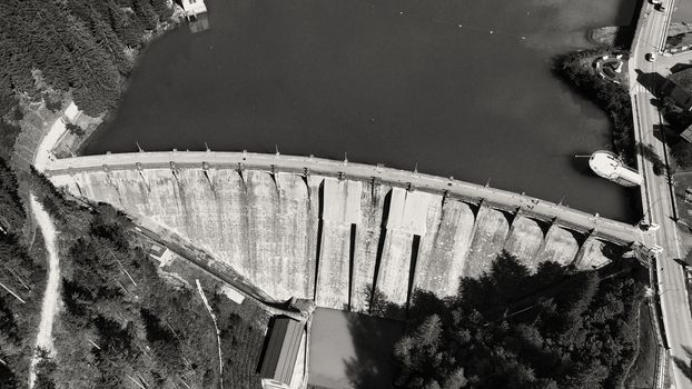 Alpin lake and dam in summertime, view from drone, Auronzo, italian dolomites.