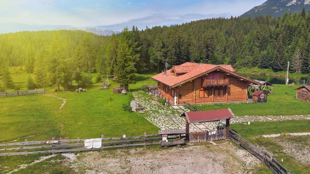 DANTA, ITALY - JULY 2020: Alpin restaurant over the lake in summer season, aerial view.