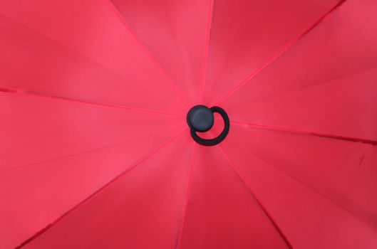 Close up view at the colorful surface of a rainproof umbrella