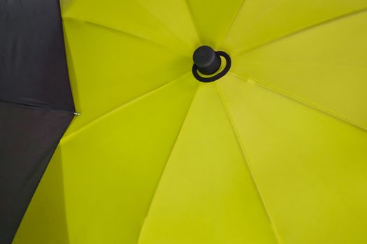 Close up view at the colorful surface of a rainproof umbrella