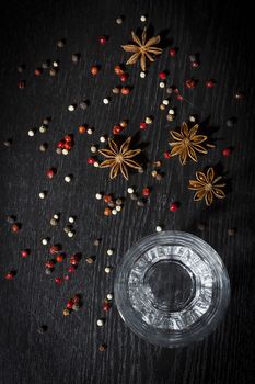 Anise vodka in a glass on a wooden surface