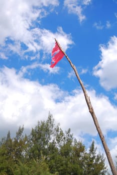 Anawangin Cove red marker flag closer look in San Antonio, Zambales