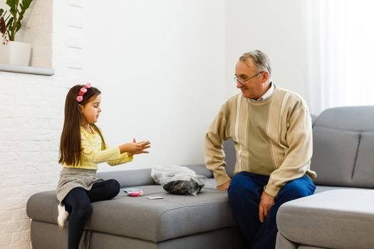 grandfather and granddaughter do her homework