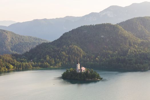 Lake Bled, island with a church and the alps in the background, Slovenia.