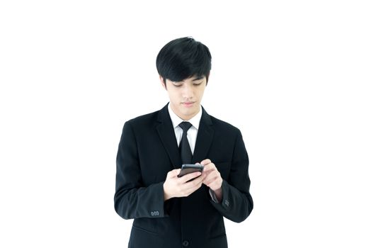 Asia businessman with black suit and black necktie has using phone isolated on white background.