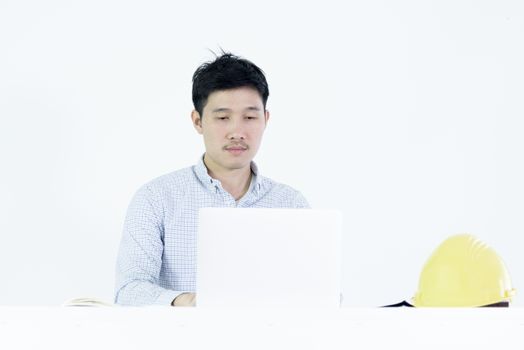 Asian employee engineer salary man sitting at desk and working with lazy and sleepy, isolated on white background.