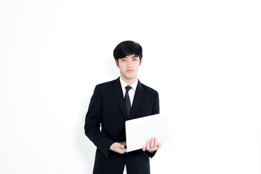 Asian business handsome man has holding laptop for woking isolated on white background.