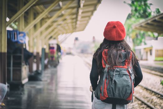 Asian woman traveler has waiting the train at Hua Lamphong station at Bangkok, Thailand.