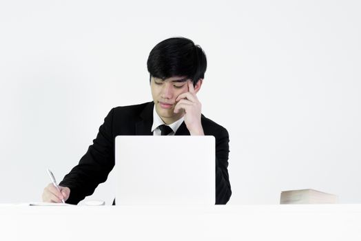 Asian manager businessman sitting at desk and working, isolated on white background.