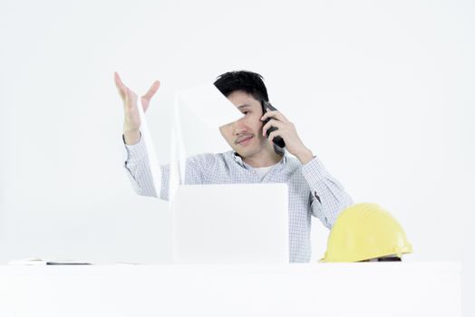 Asian employee engineer salary man sitting at desk throwing papers with feeling angry and upset, isolated on white background.