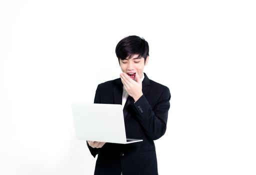 Asian business handsome man has holding laptop for woking with happy and relaxing isolated on white background.