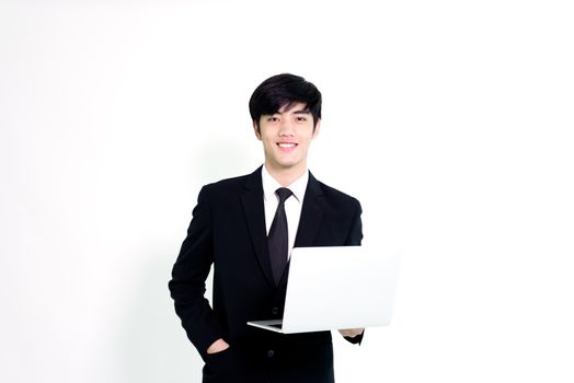 Asian business handsome man has holding laptop for woking with happy and relaxing isolated on white background.