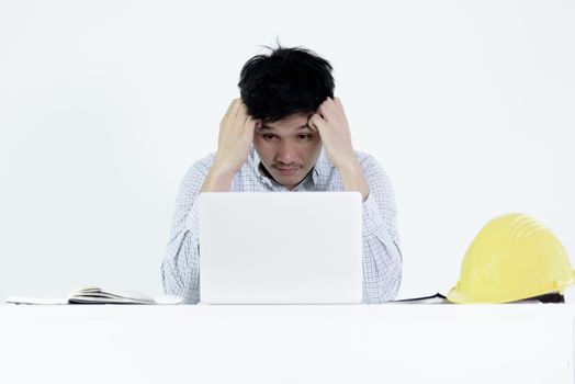 Asian employee engineer salary man sitting at desk and working with feeling sleepy, isolated on white background.