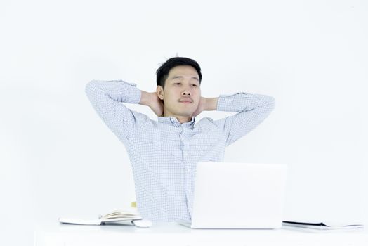 Asian employee salary man sitting at desk and working with lazy and sleepy, isolated on white background.