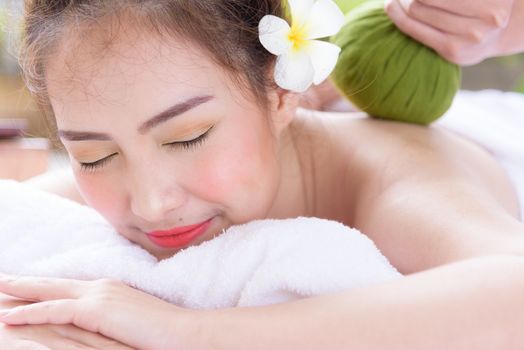 Portrait of beautiful asian people with close up view and close up eyes and having hand massage in spa salon. Beauty, healthy, spa and relaxation concept.