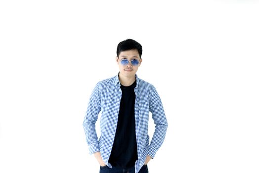 Asian handsome man with blue scott shirt, black shirt and blue eyeglasses isolated on white background.