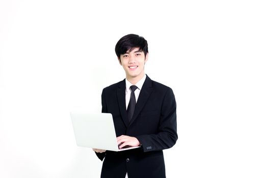 Asian business handsome man has holding laptop for woking with happy and relaxing isolated on white background.