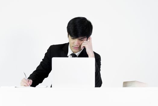 Asian manager businessman sitting at desk and working, isolated on white background.