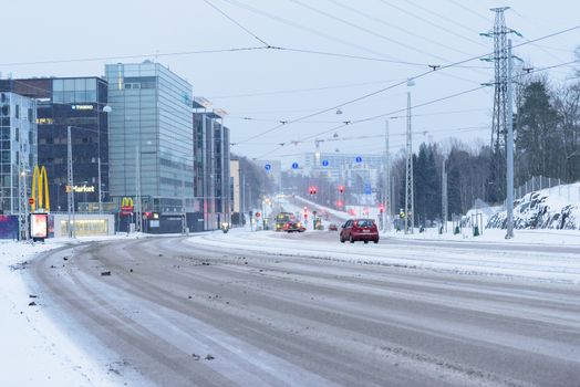 Editorial: Helsinki City, Finland, 21th December 2018. Car on the road with snow in winter season at Helsinki, Finland.