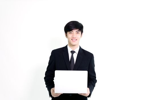 Asian business handsome man has holding laptop for woking with happy and relaxing isolated on white background.