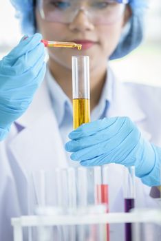 Asian young girl student scientist researching  and learning in a laboratory.