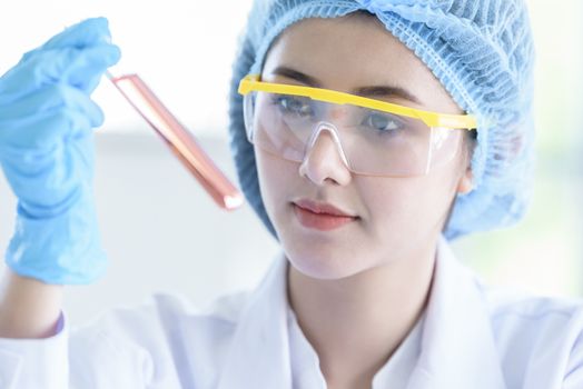 Asian young girl student scientist researching  and learning in a laboratory.