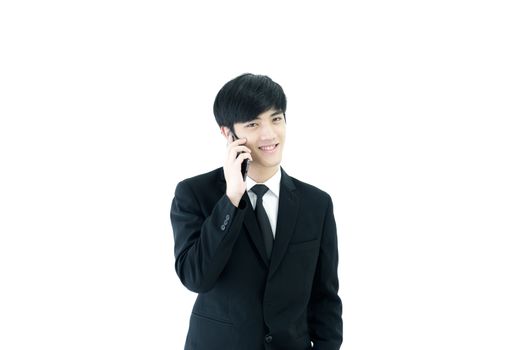 Asia businessman with black suit and black necktie has talking by  phone isolated on white background.