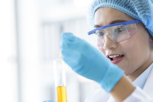 Asian young girl student scientist researching  and learning in a laboratory.